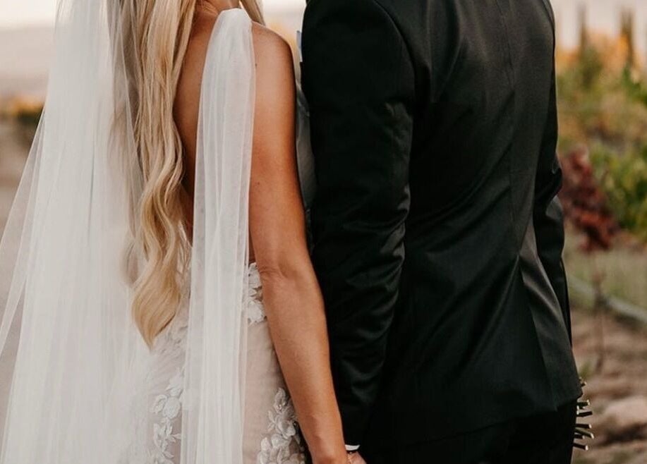 Couple in wedding attire at Glory Glow 2G Mobile Spray Tan Greater Scottsdale, Scottsdale, Arizona, US.