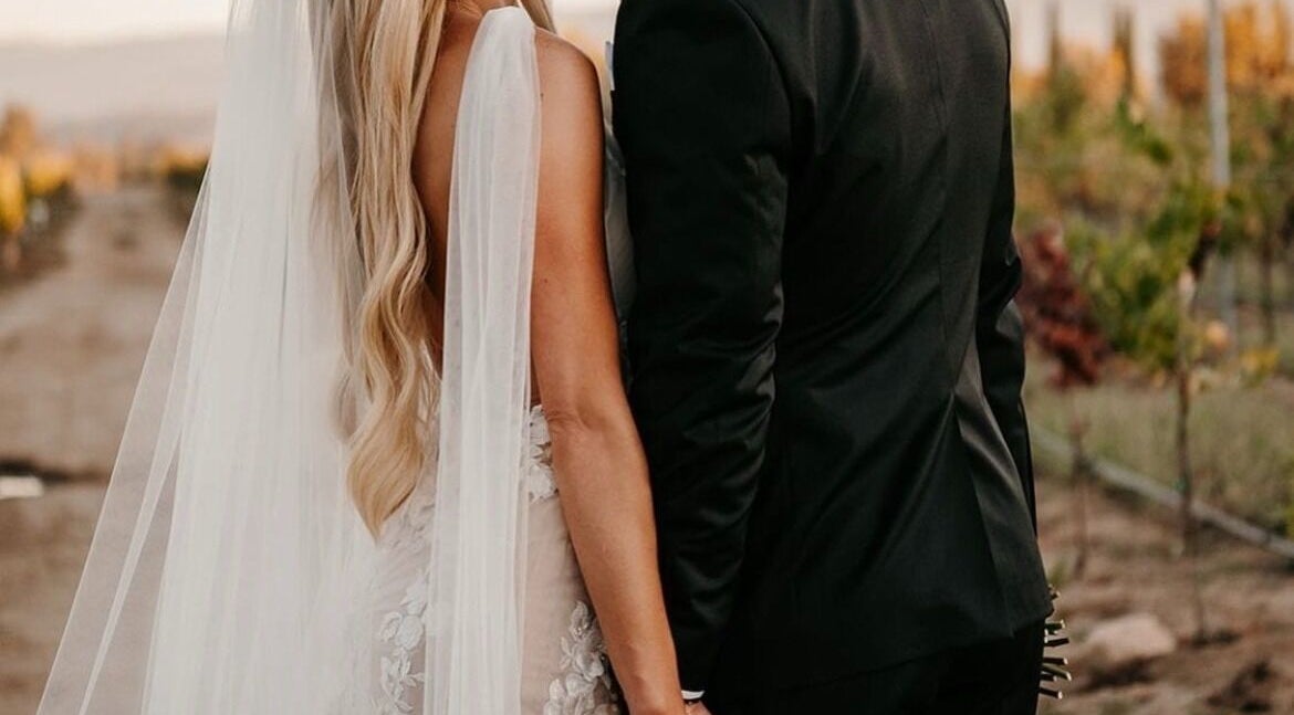 Couple in wedding attire at Glory Glow 2G Mobile Spray Tan Greater Scottsdale, Scottsdale, Arizona, US.