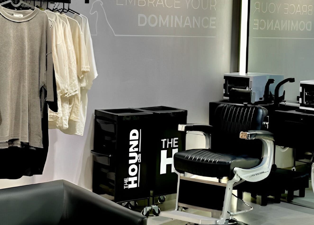 Modern salon interior at The Hound DXB, Dubai, Dubai, AE, featuring stylish chairs and chic apparel display.