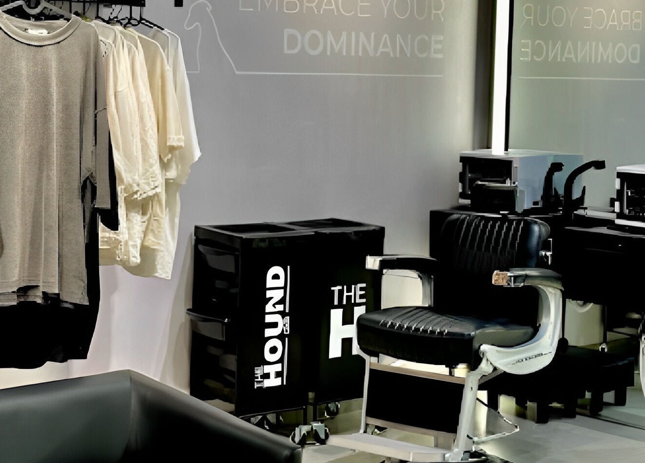 Modern salon interior at The Hound DXB, Dubai, Dubai, AE, featuring stylish chairs and chic apparel display.