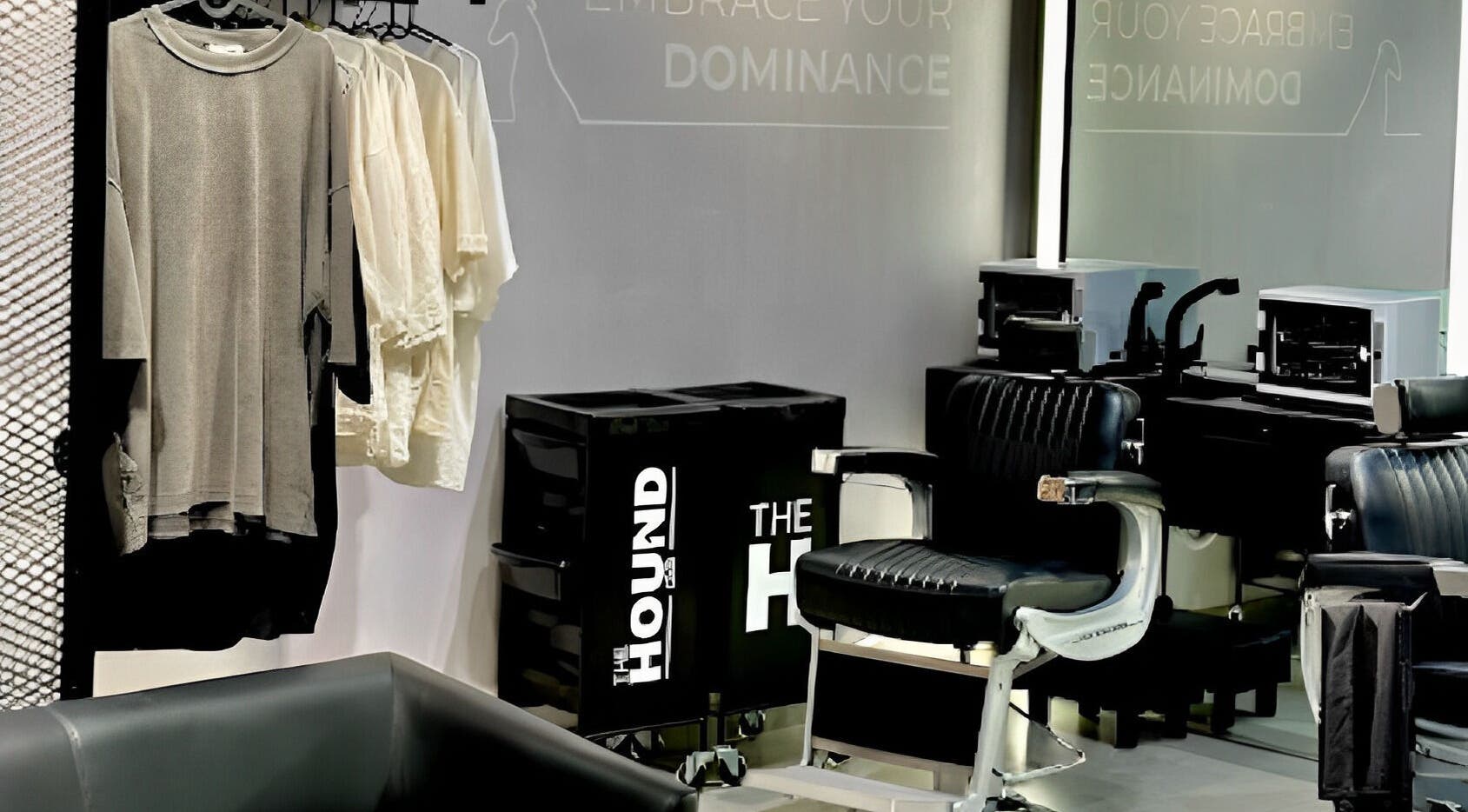 Modern salon interior at The Hound DXB, Dubai, Dubai, AE, featuring stylish chairs and chic apparel display.