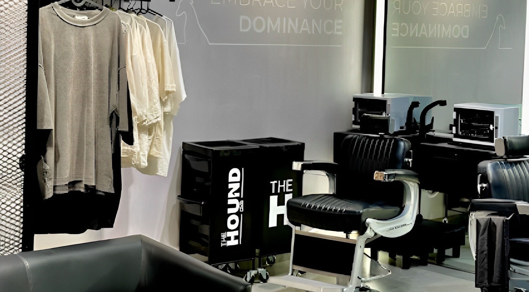 Modern salon interior at The Hound DXB, Dubai, Dubai, AE, featuring stylish chairs and chic apparel display.