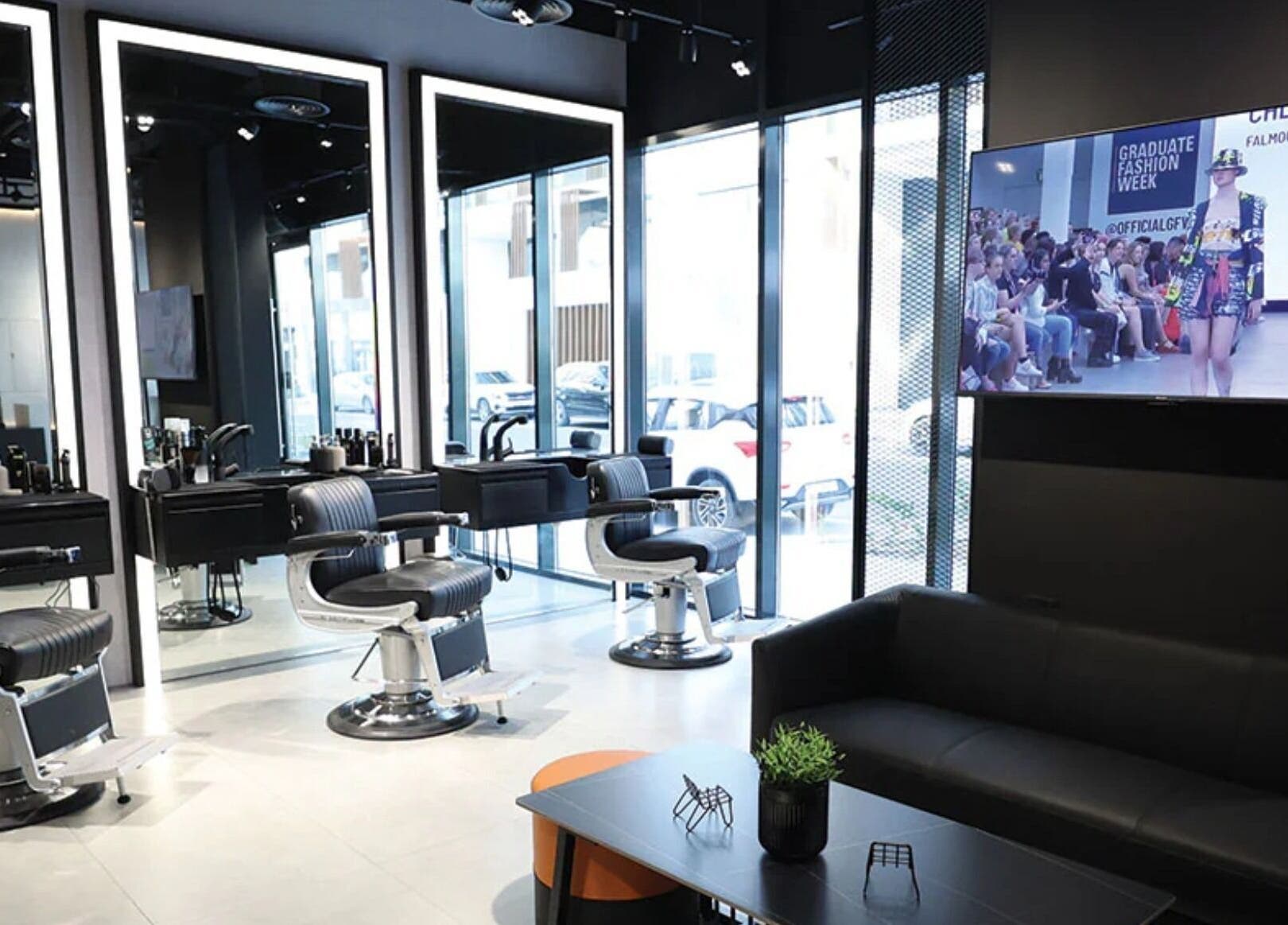 Modern interior of The Hound DXB in Dubai, Dubai, AE with sleek barber chairs and stylish decor.