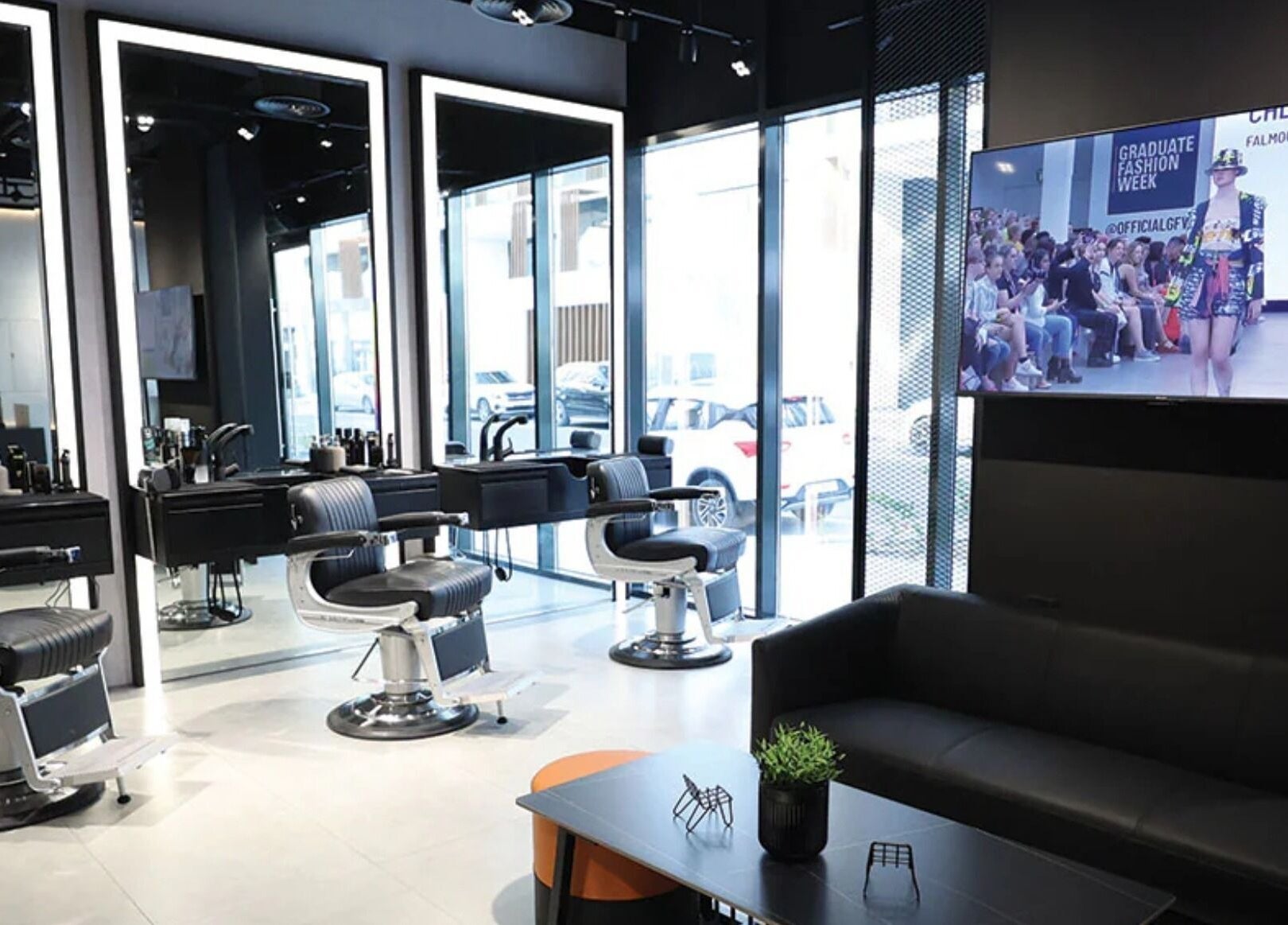 Modern interior of The Hound DXB in Dubai, Dubai, AE with sleek barber chairs and stylish decor.