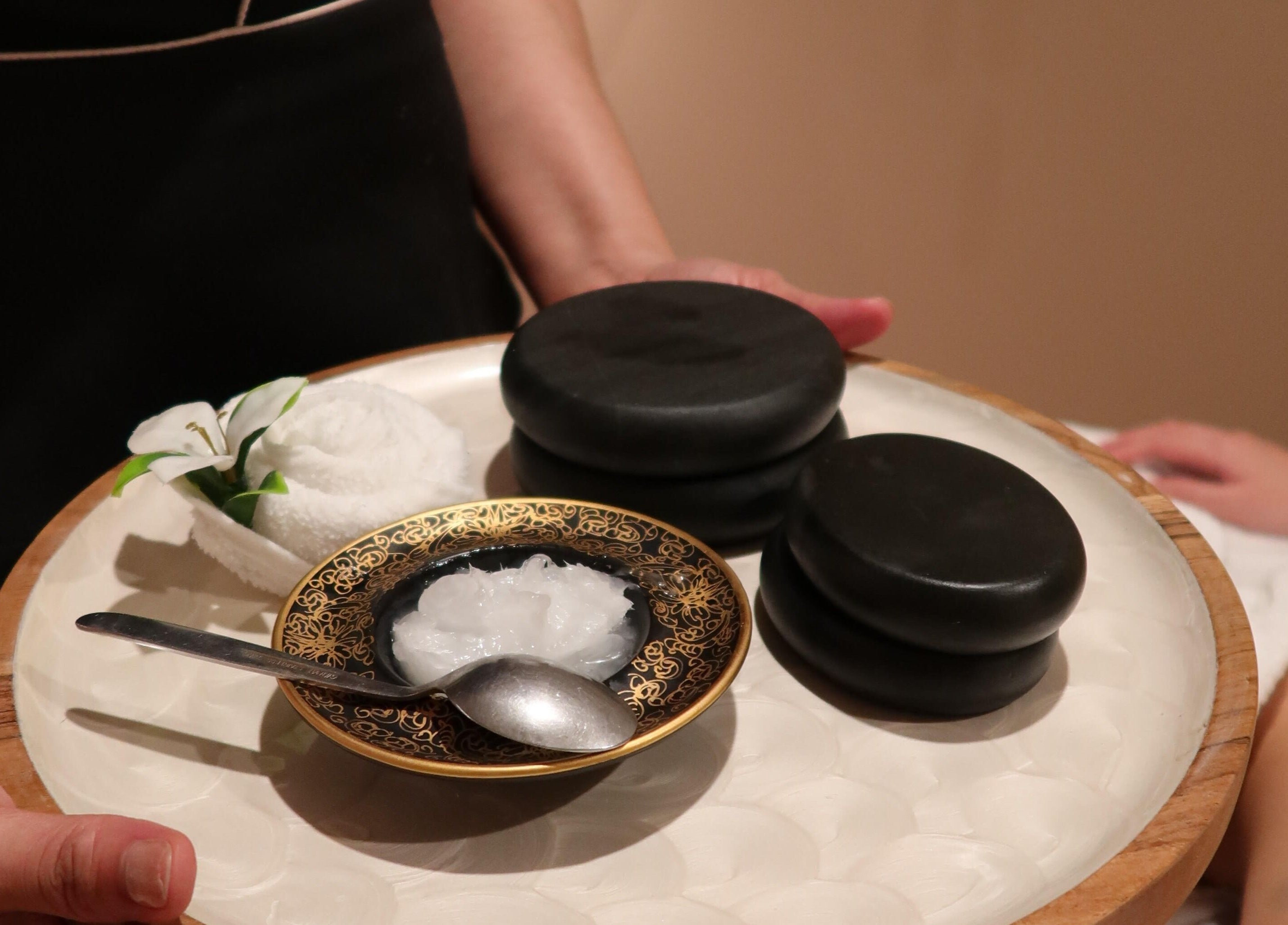 Relaxation essentials at Thai Oasis Lifestyle Massage & Spa, Stanmore, New South Wales, AU, featuring hot stones.