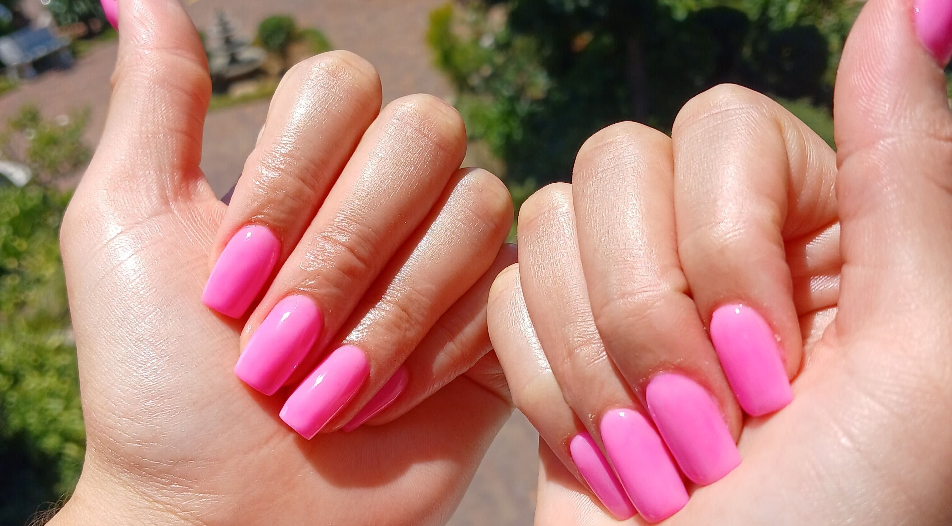 Vibrant pink manicured nails at Pretty Fabulous Beauty in Sandton, Gauteng, ZA.