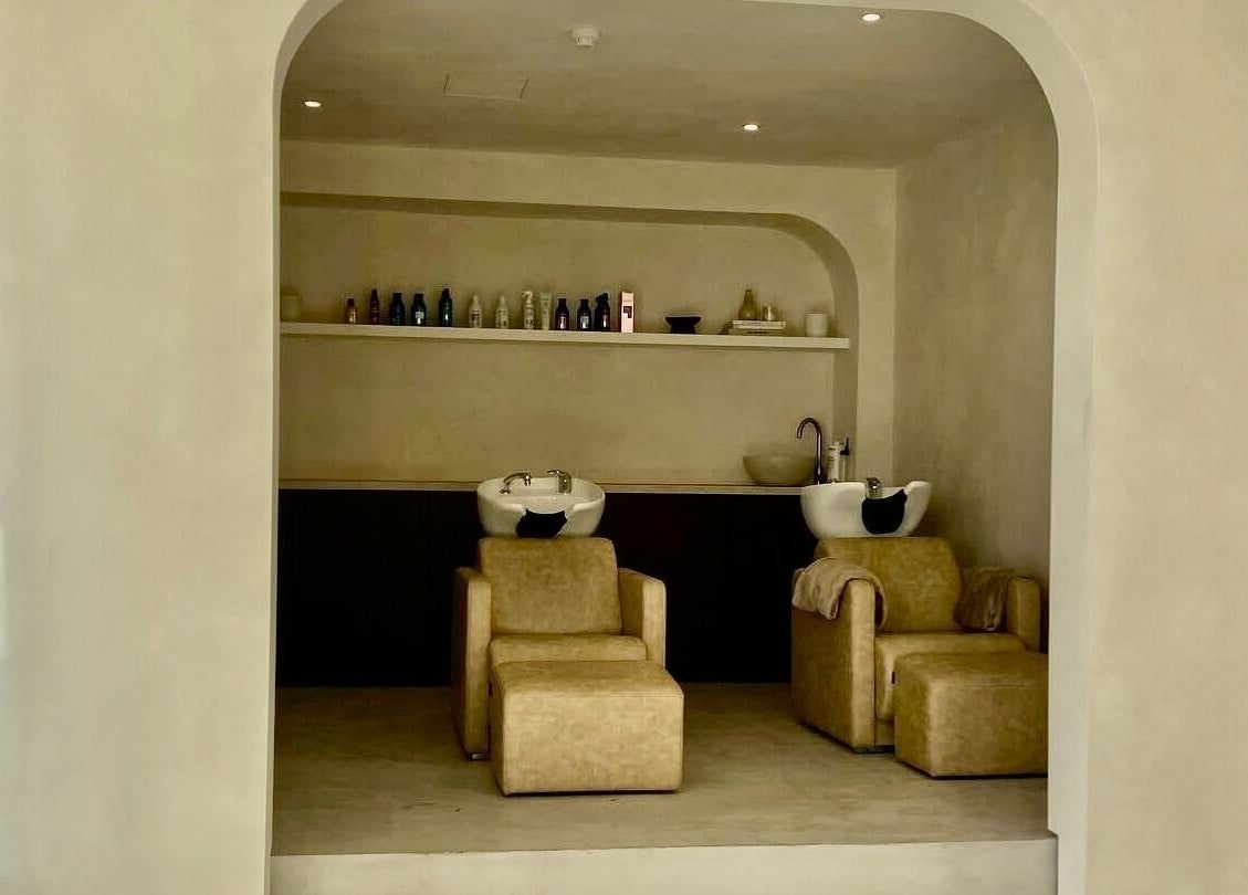 Stylish wash area at ZJB Lashes, Southampton, England, GB, featuring modern sinks and plush chairs.