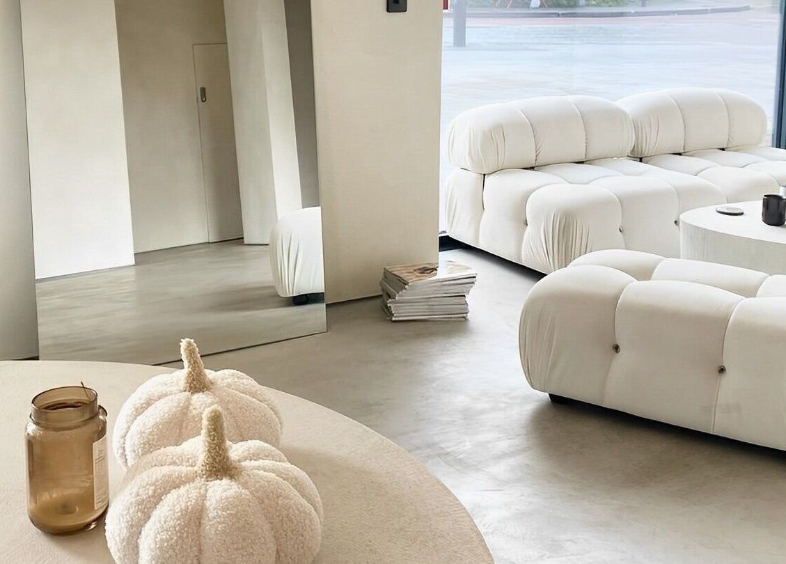 Modern, cozy lounge area at ZJB Lashes, Southampton, England, GB with plush white seating and chic decor.