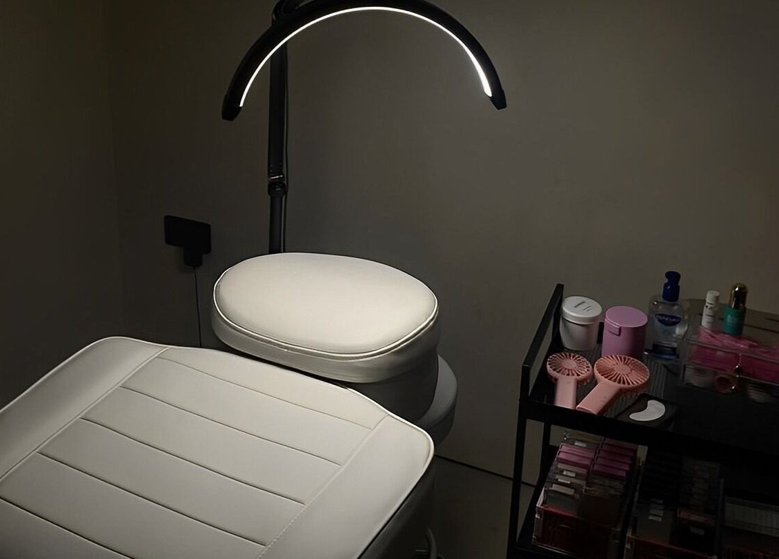 Cozy lash treatment setup at ZJB Lashes in Southampton, England, GB, featuring a plush white chair and organized tools.