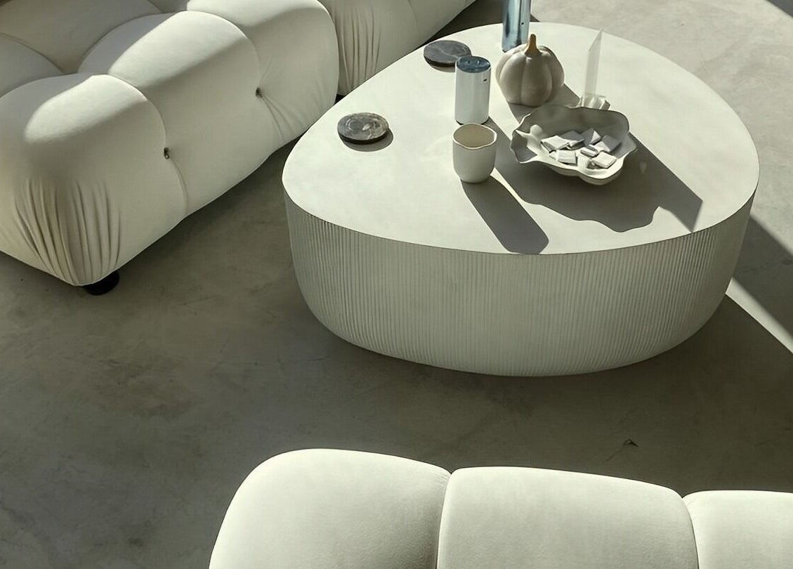 Modern elegant seating area at ZJB Lashes, Southampton, England, GB with a stylish white couch and table.