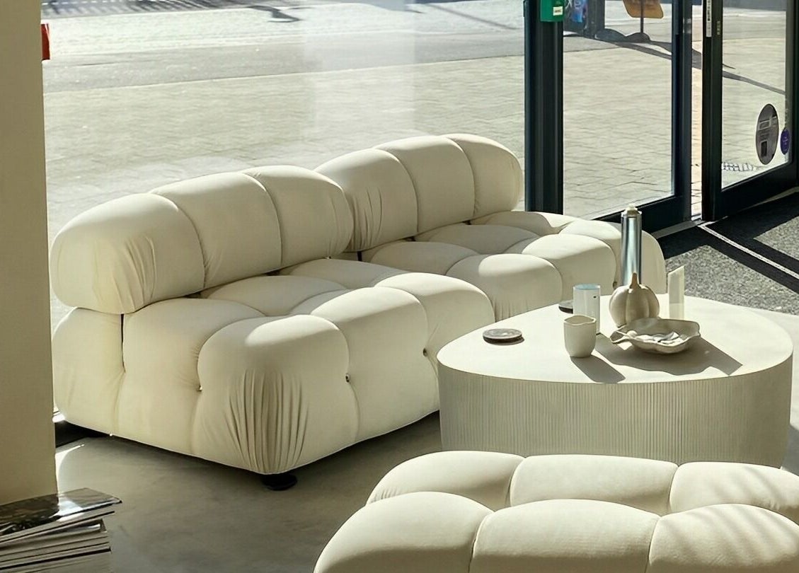 Modern beige lounge area at ZJB Lashes, Southampton, England, GB, radiating warmth and comfort.