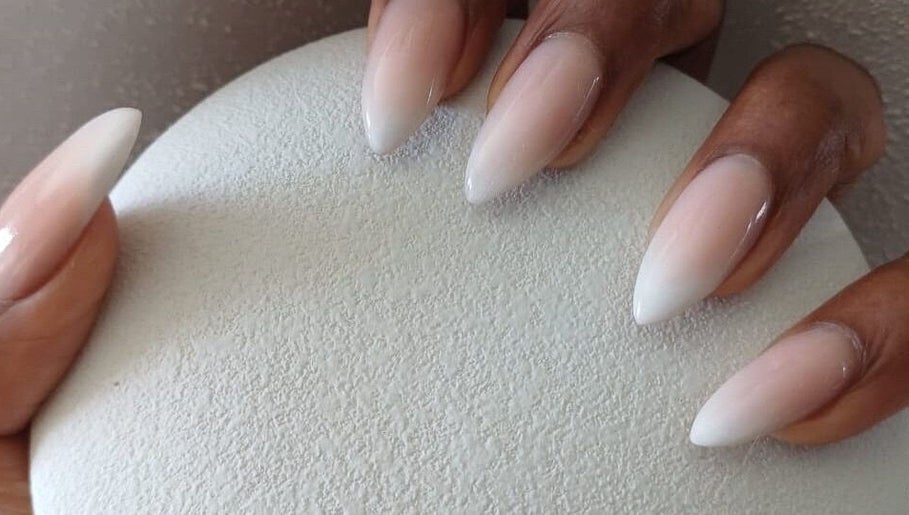 Elegant nude ombre nails at Jasmine Beauty and Wellness, Midrand, Gauteng, ZA, showcasing sophisticated nail design.