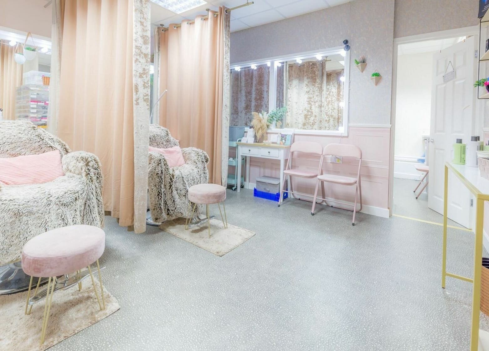 Elegant beauty studio interior at Changing Faces Studio, Exeter. Plush chairs and chic decor enhance relaxation.