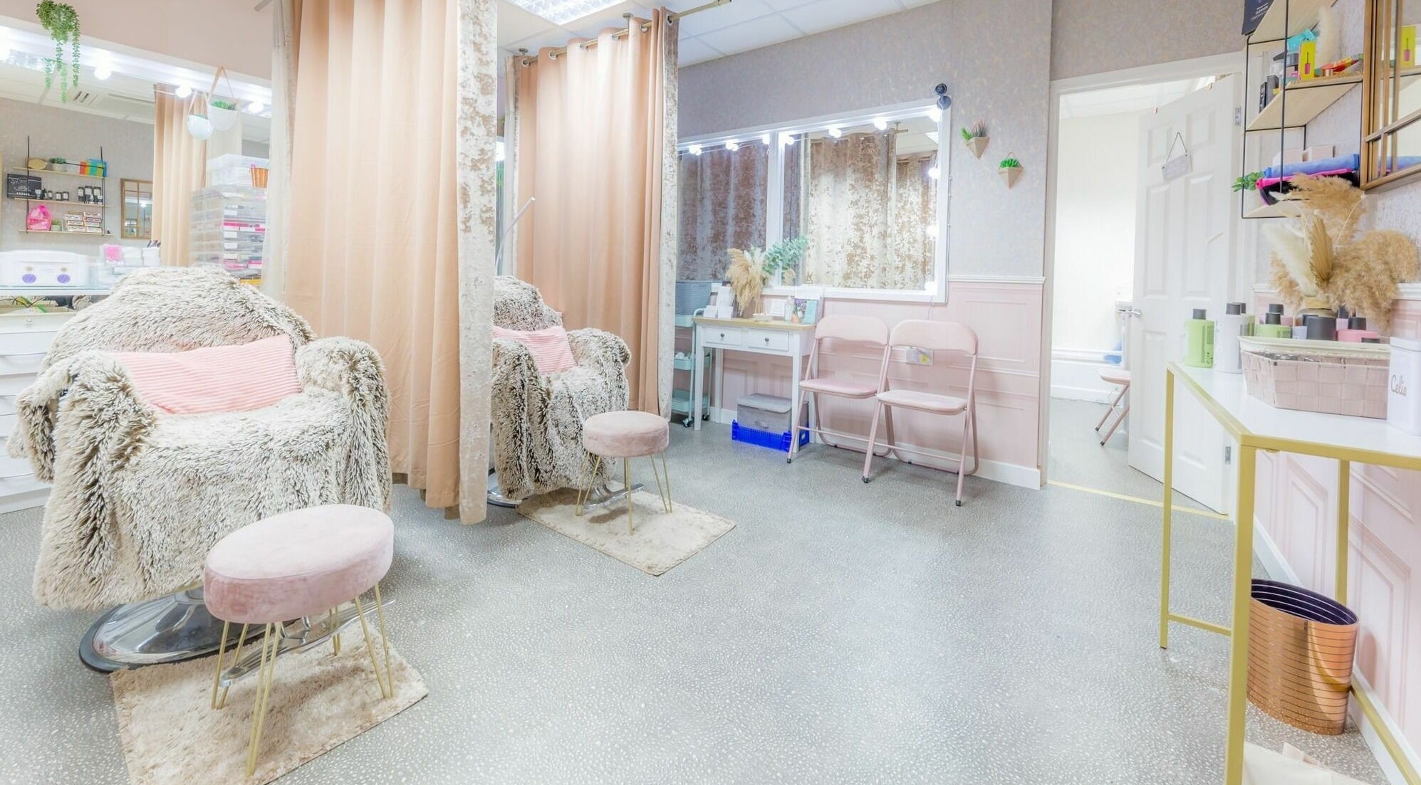 Elegant beauty studio interior at Changing Faces Studio, Exeter. Plush chairs and chic decor enhance relaxation.