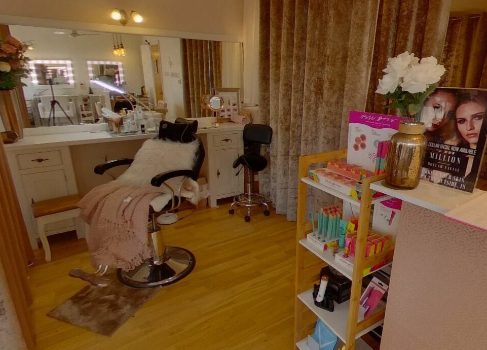 Interior of Changing Faces Studio in Exeter, England, GB with stylish salon chair and beauty products.