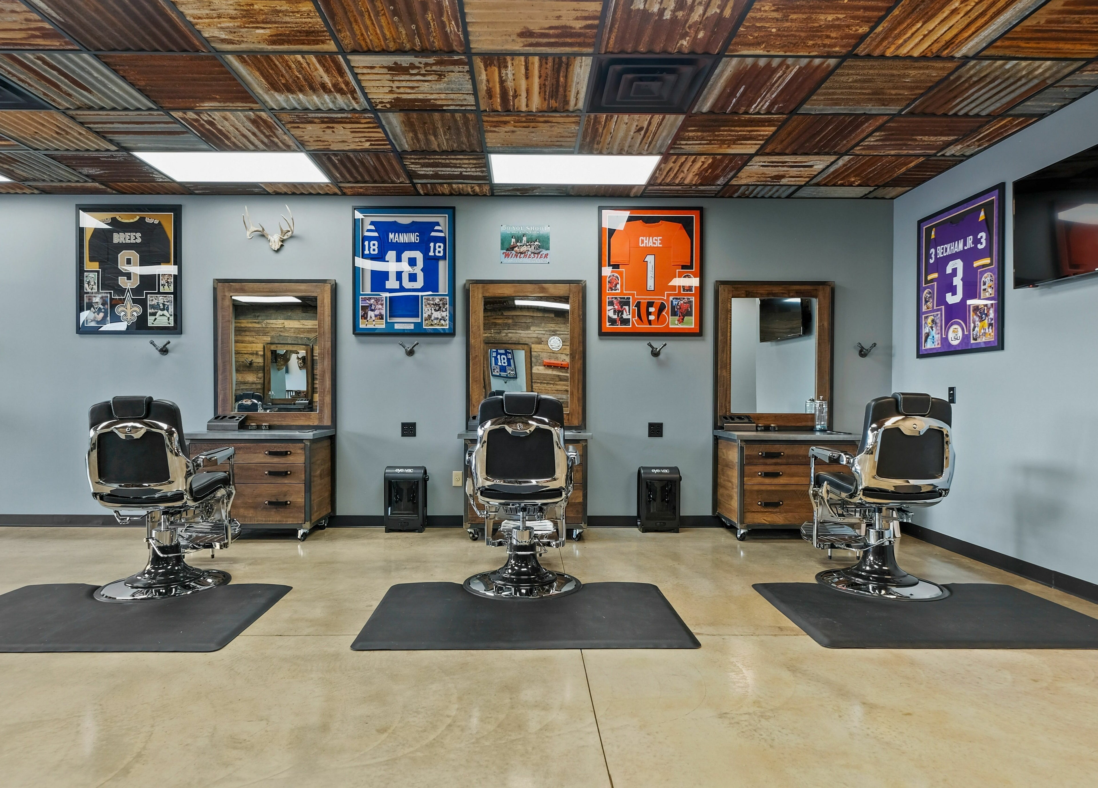 Barber chairs at Mancave Cenla in Pineville, Louisiana, US, offering a stylish vintage atmosphere.