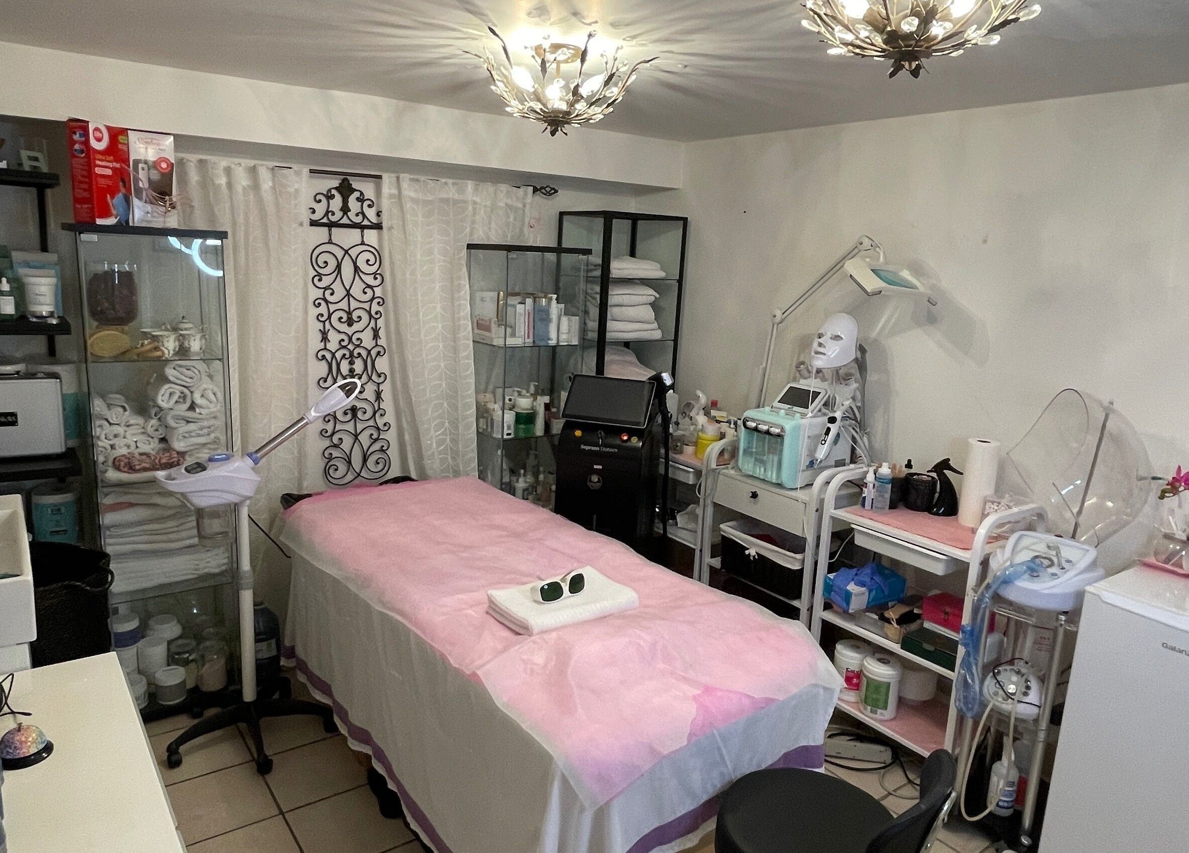 Modern treatment room at Essence laser and skin care, Toronto, Ontario, CA with professional equipment and decor.