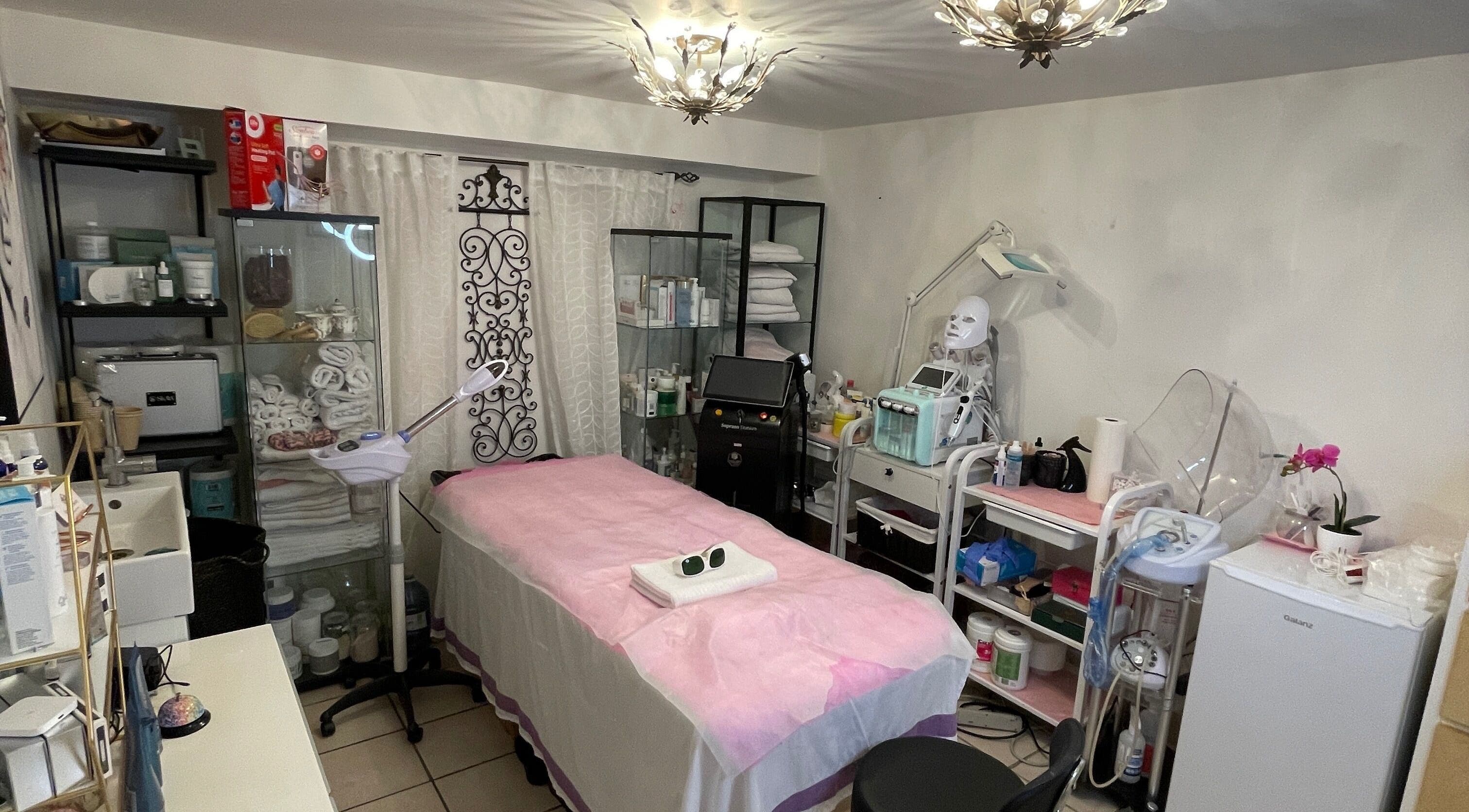 Modern treatment room at Essence laser and skin care, Toronto, Ontario, CA with professional equipment and decor.