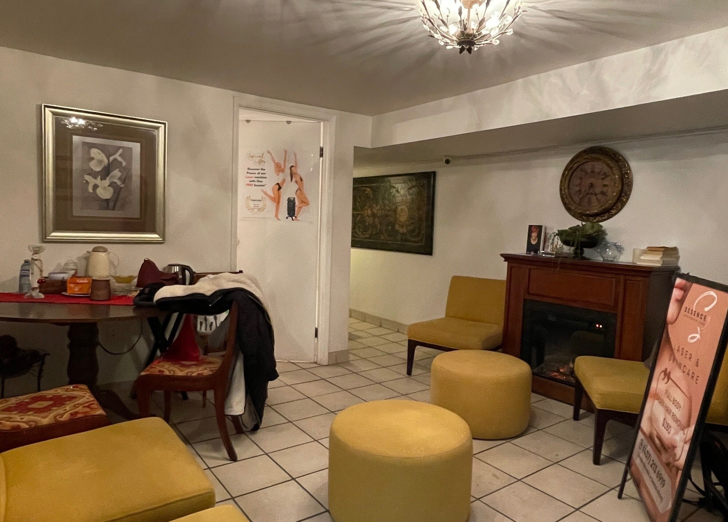 Lounge area at Essence Laser and Skin Care in Toronto, Ontario, CA with yellow seating and decor.
