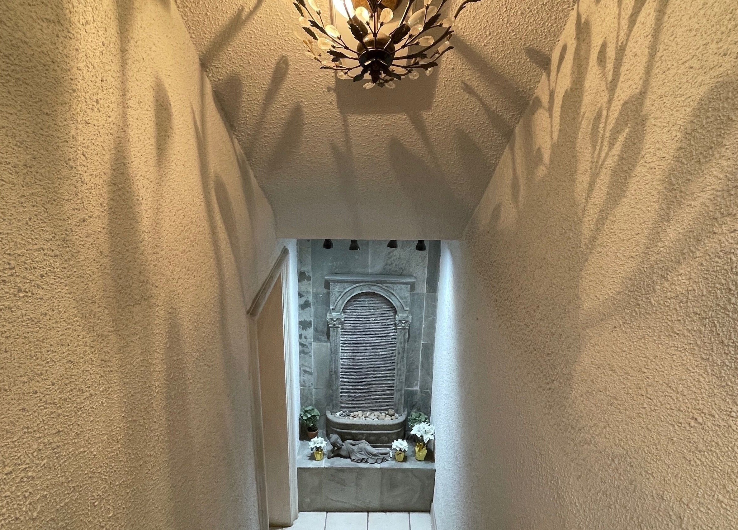 Elegant hallway with ornate lighting at Essence Laser and Skin Care, Toronto, Ontario, CA.