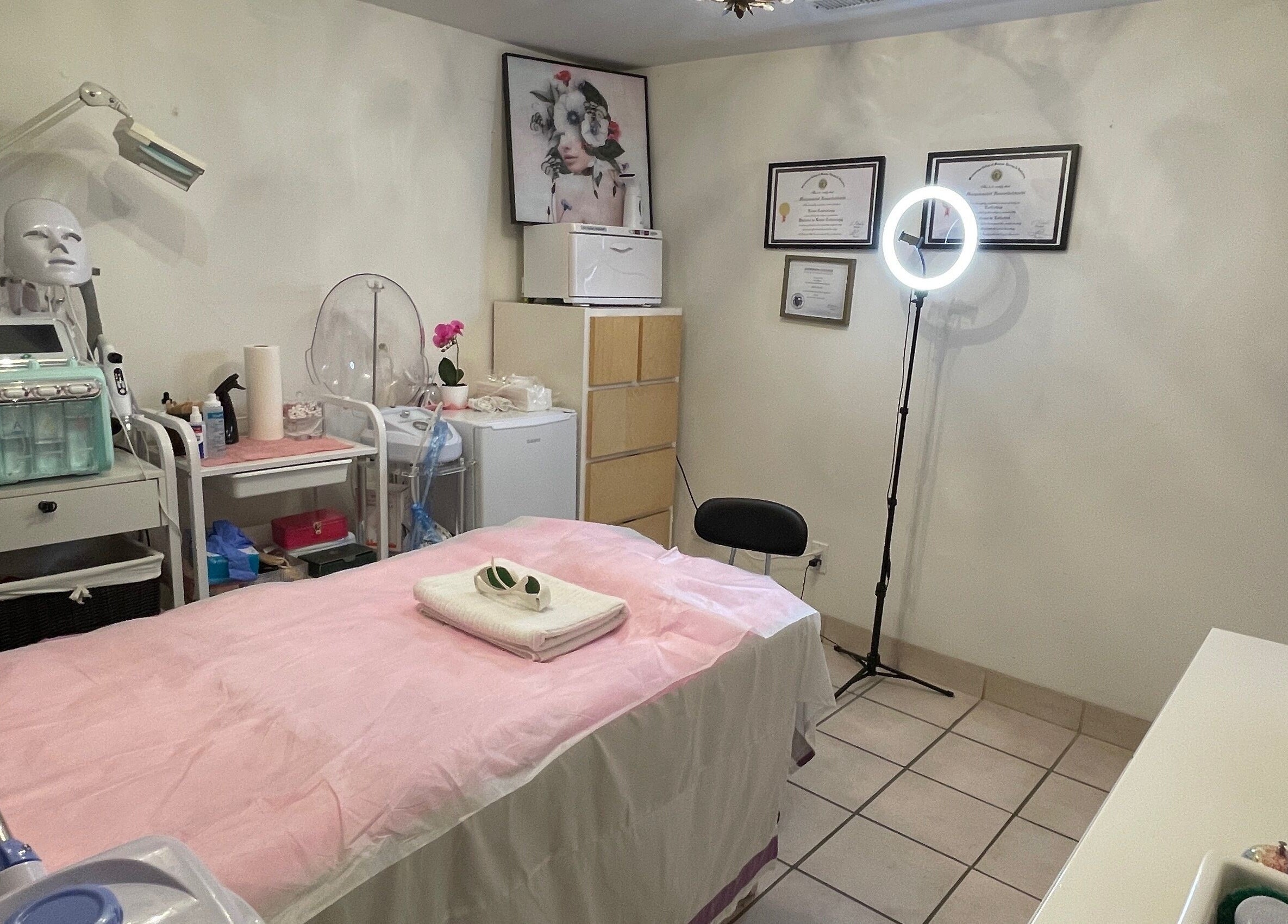 Tranquil treatment room at Essence Laser and Skin Care in Toronto, Ontario, CA, showcasing modern equipment and decor.