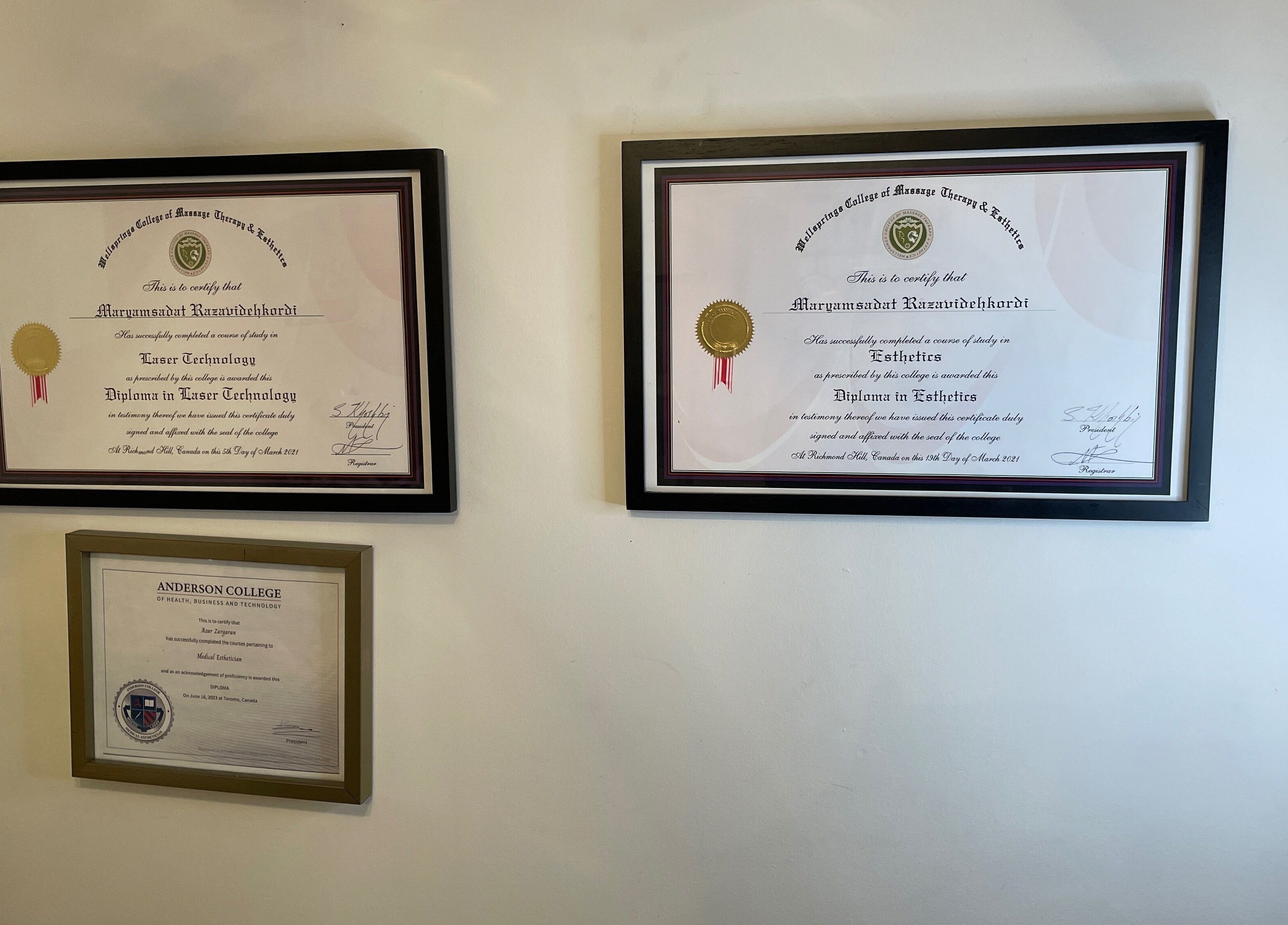 Framed certifications showcasing expertise at Essence laser and skin care, Toronto, Ontario, CA.