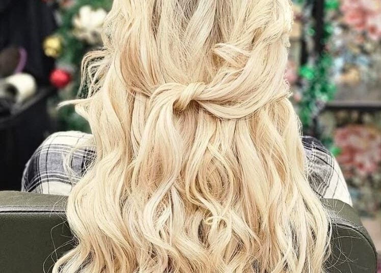Blonde hair in elegant curls at Monique's Hair Extension Boutique, Great Finborough, England, GB.