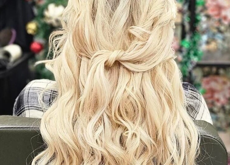 Blonde hair in elegant curls at Monique's Hair Extension Boutique, Great Finborough, England, GB.