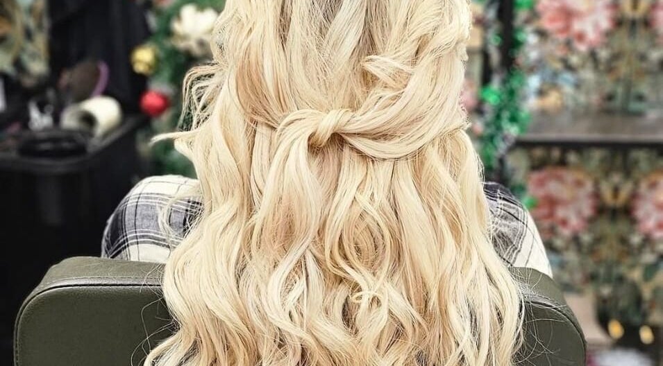 Blonde hair in elegant curls at Monique's Hair Extension Boutique, Great Finborough, England, GB.
