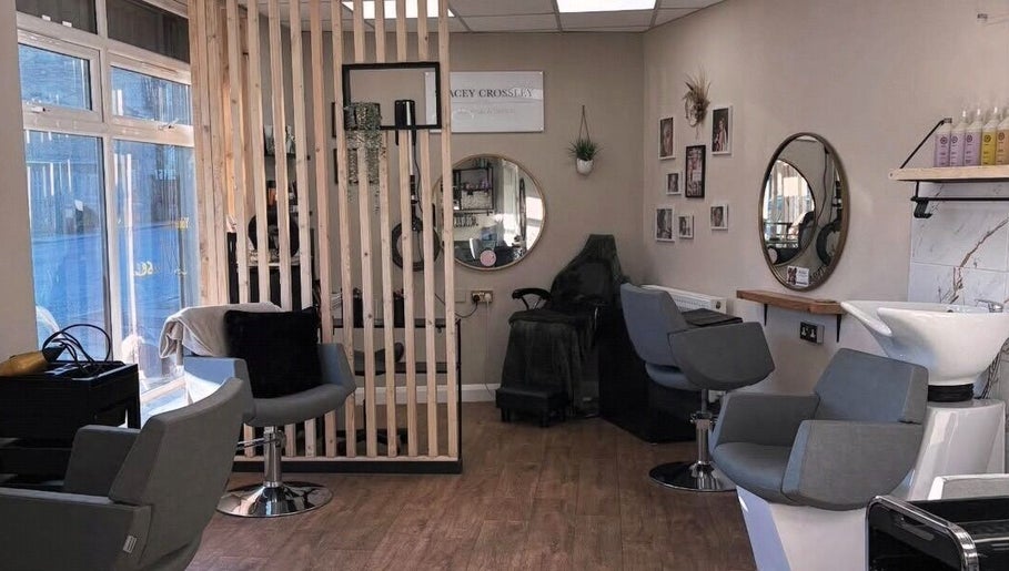 Interior of Stacey Crossley Make-up & Beauty in Brighouse, England, GB featuring stylish chairs and mirrors.