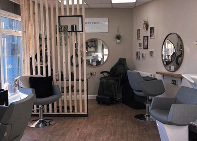 Interior of Stacey Crossley Make-up & Beauty in Brighouse, England, GB featuring stylish chairs and mirrors.