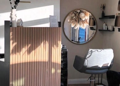 Stacey Crossley Make-up & Beauty's stylish interior in Brighouse, England, showcasing a modern salon chair and decor.
