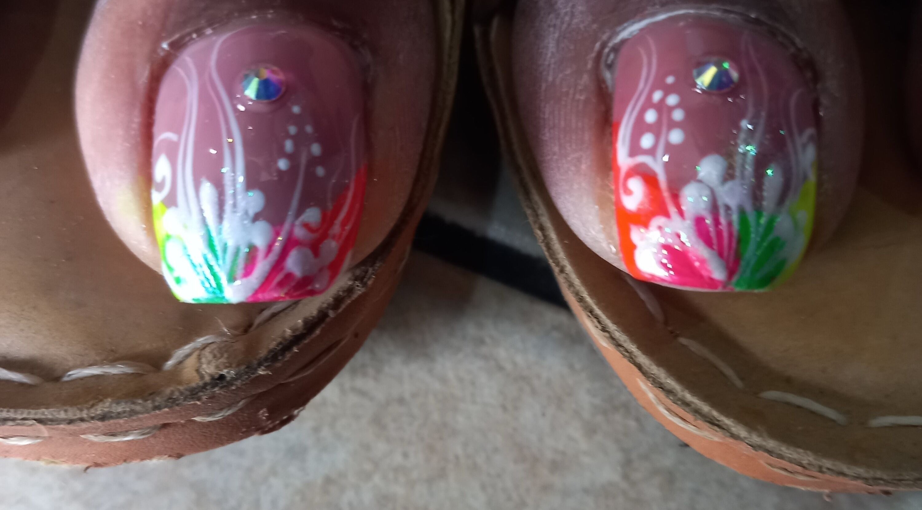 Bright floral nail design at Nailz Dezurve Jody, Siparia, TT. Colorful art perfect for a unique style.