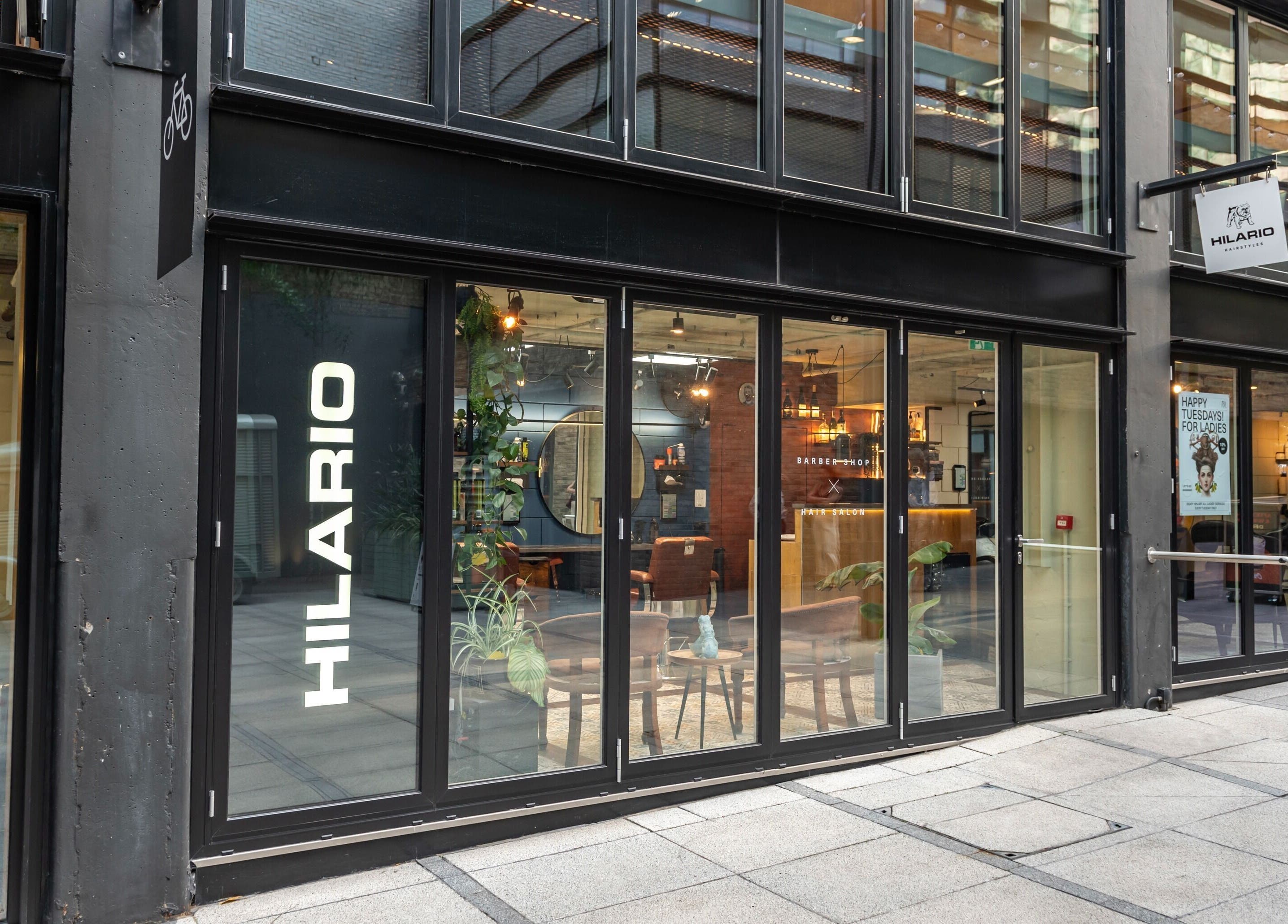 Exterior view of Hilario beauty and wellness venue in London, England, GB showcasing modern glass doors.
