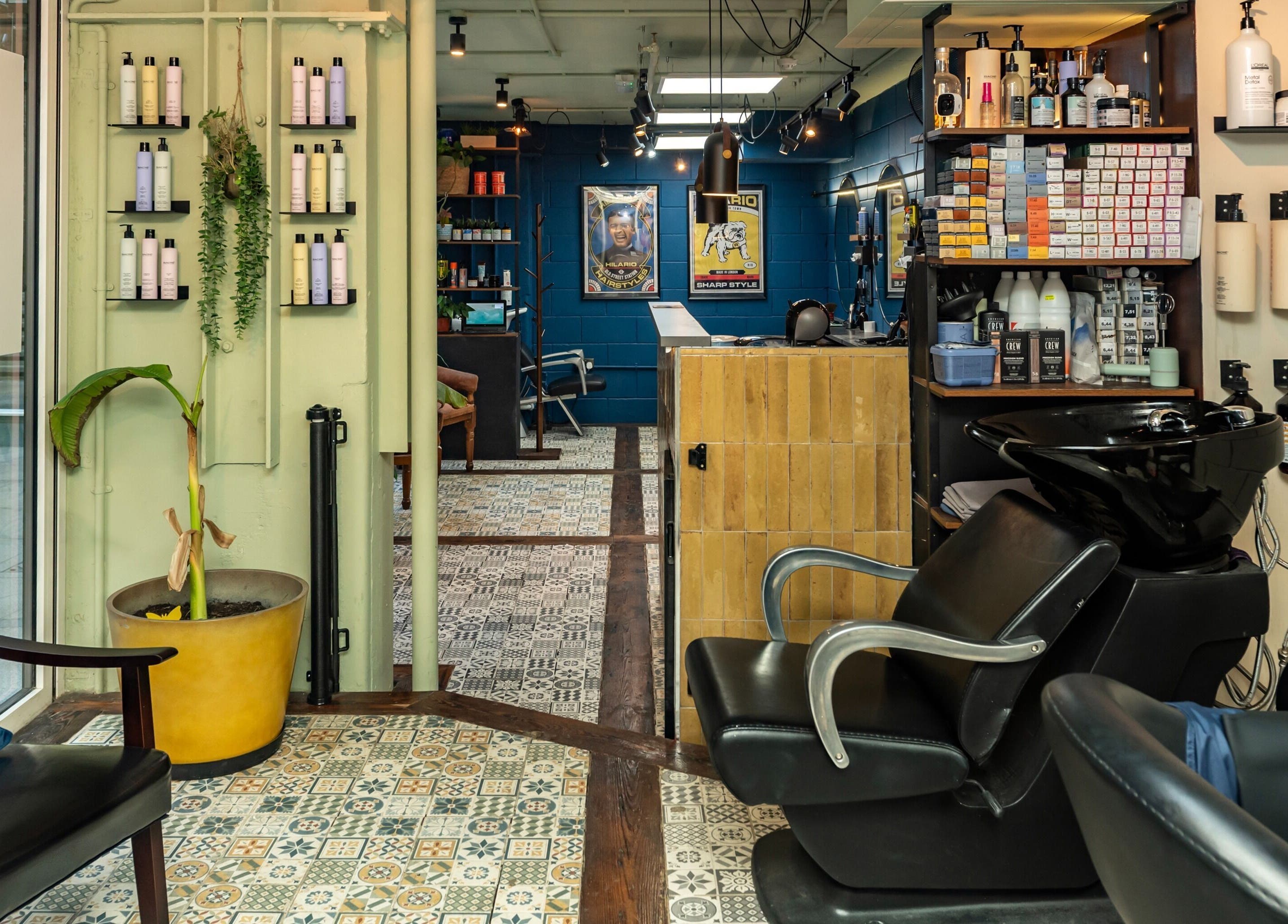 Modern salon interior at Hilario, London, England, GB featuring chic decor and a professional layout.