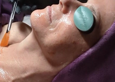 Client receiving facial treatment at Mud and Lotus Skincare, Burnsville, North Carolina, US.