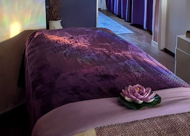 Tranquil massage room at Mud and Lotus Skincare in Burnsville, North Carolina, US, featuring calming decor.