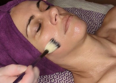 Facial treatment at Mud and Lotus Skincare in Burnsville, North Carolina, US, enhancing skin's radiance.