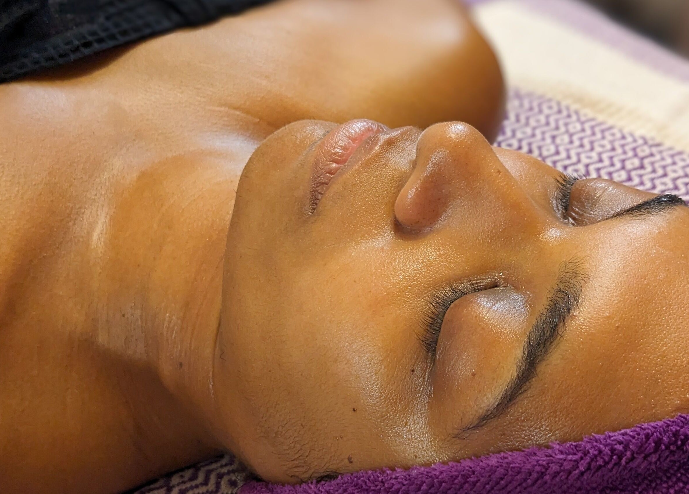 Relaxing facial at Mud and Lotus Skincare in Burnsville, North Carolina, US, highlighting a serene spa experience.