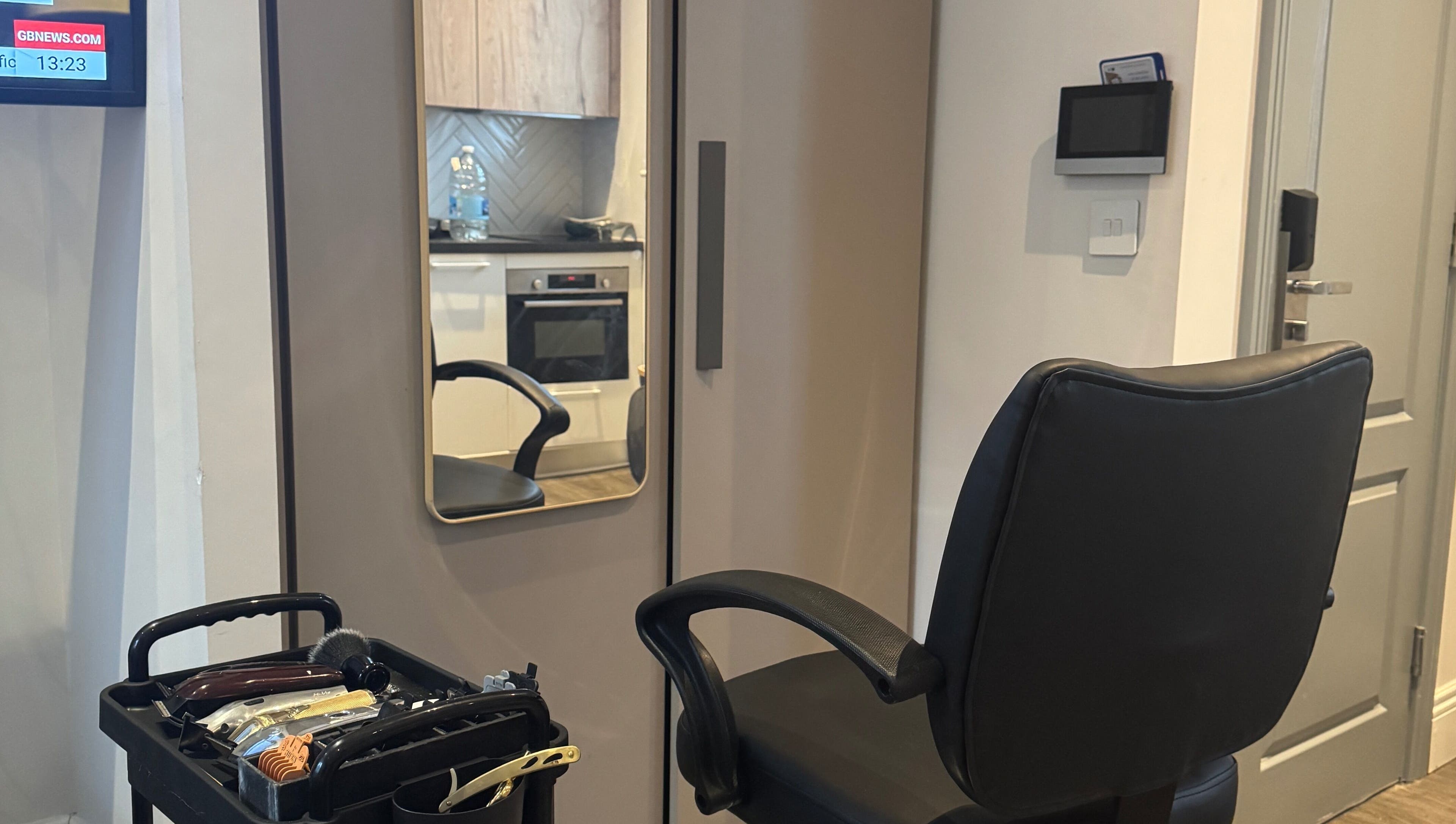 Modern barber chair and tools at Tunechi the Barber in Coventry, England, GB.
