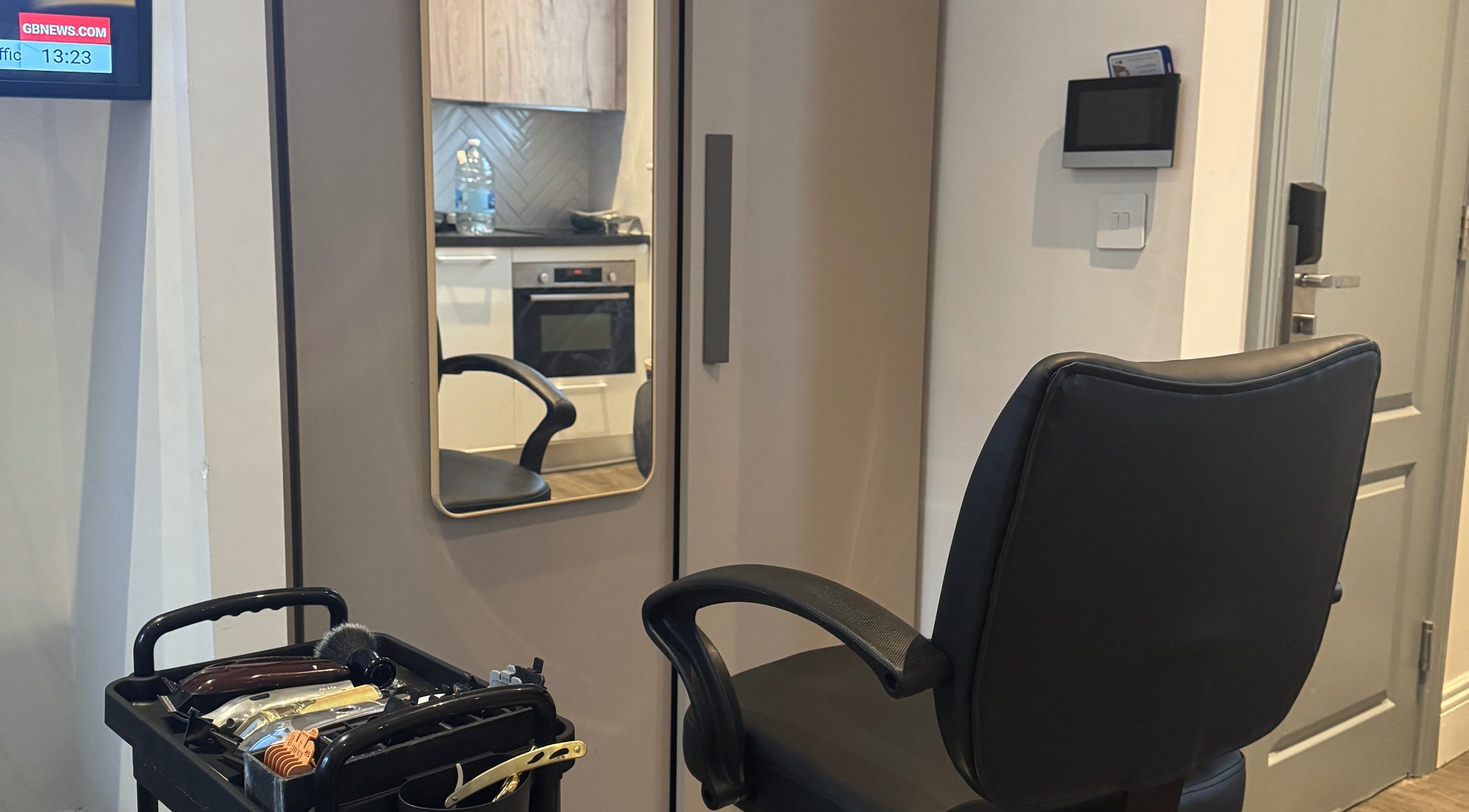 Modern barber chair and tools at Tunechi the Barber in Coventry, England, GB.