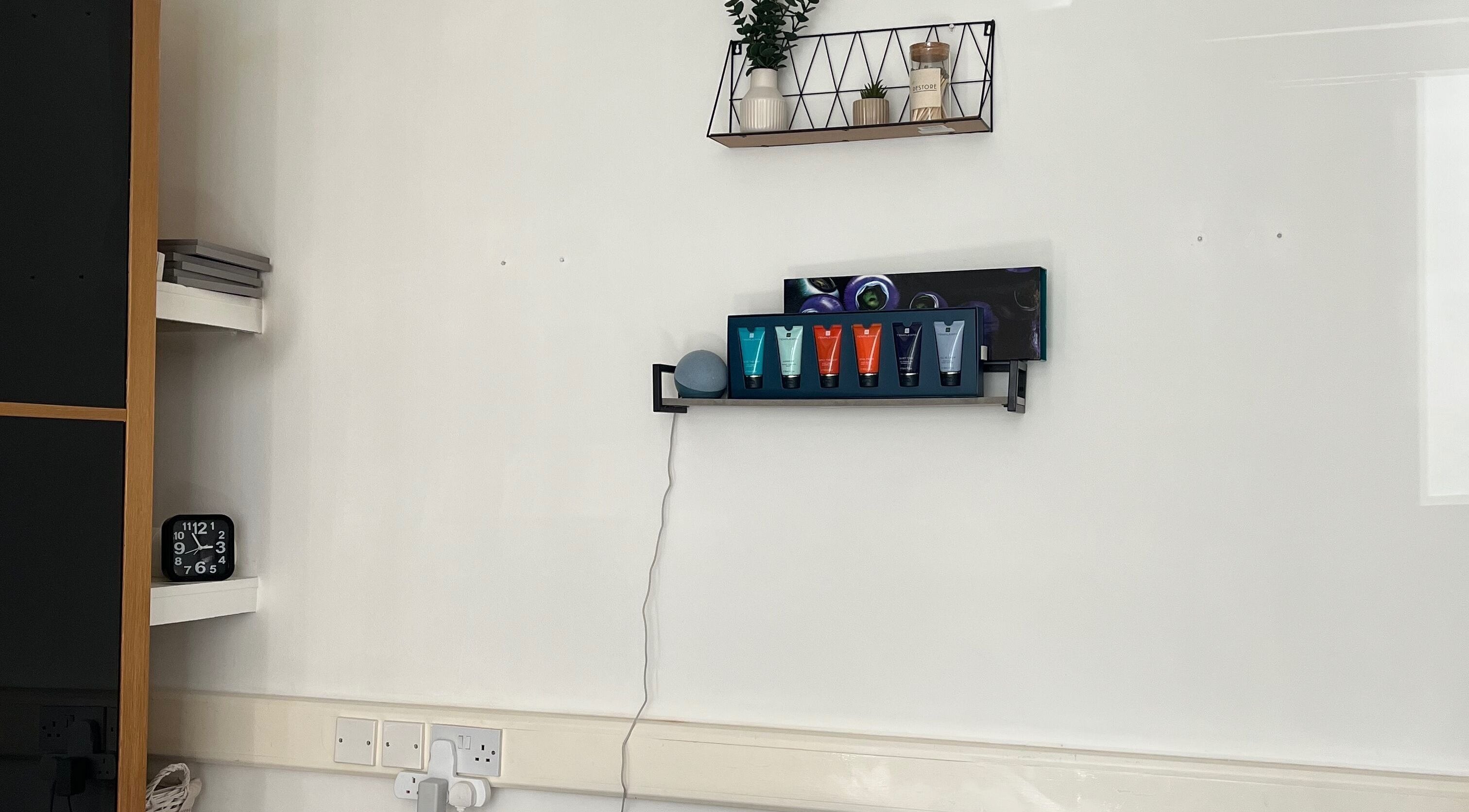 Modern shelf at Jojo May Wellbeing, Redditch, England, GB, featuring skincare products and decor.