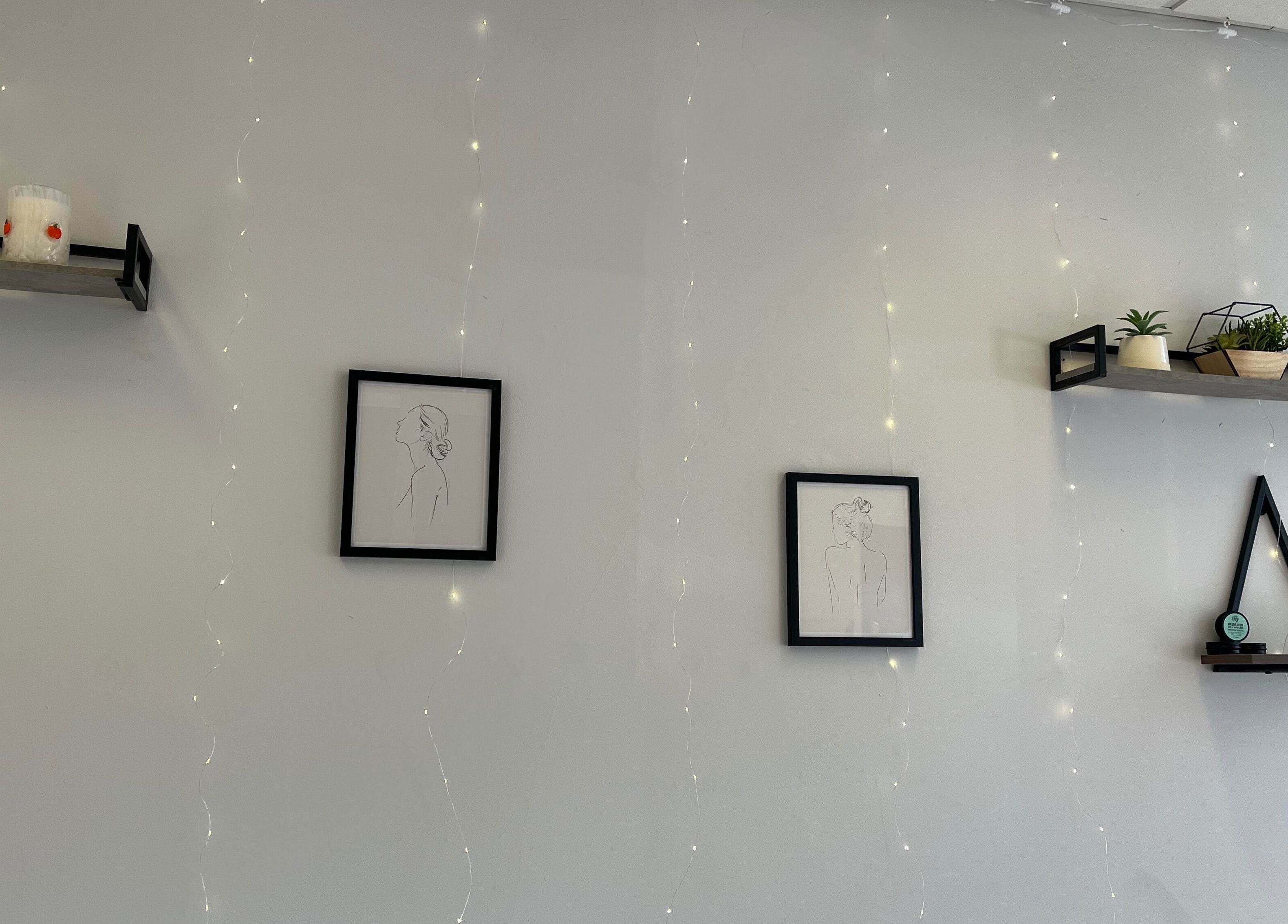 Minimalist wall art and shelves at Jojo May Wellbeing in Redditch, England, GB create a calming ambiance.