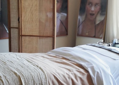 Relaxing spa treatment room at Salty Face Bali in Uluwatu, Bali, ID with cozy decor.