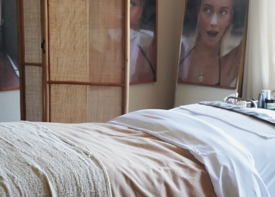 Relaxing spa treatment room at Salty Face Bali in Uluwatu, Bali, ID with cozy decor.