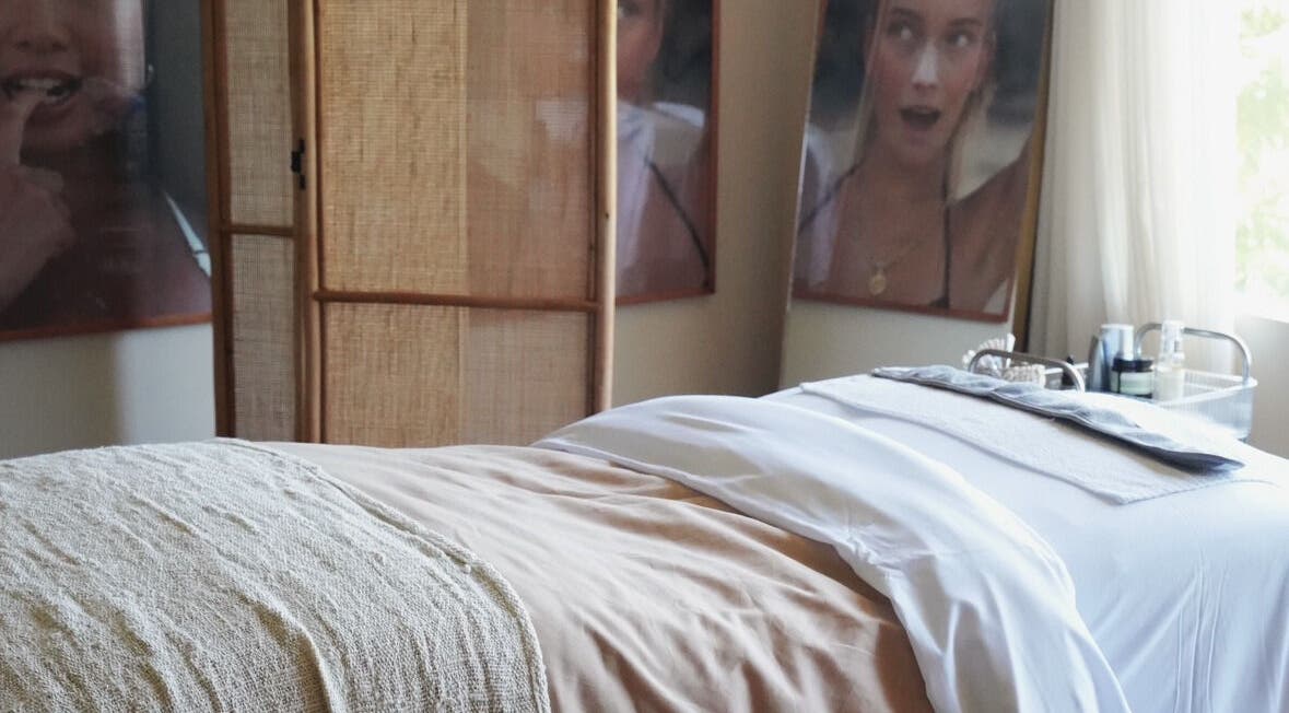 Relaxing spa treatment room at Salty Face Bali in Uluwatu, Bali, ID with cozy decor.