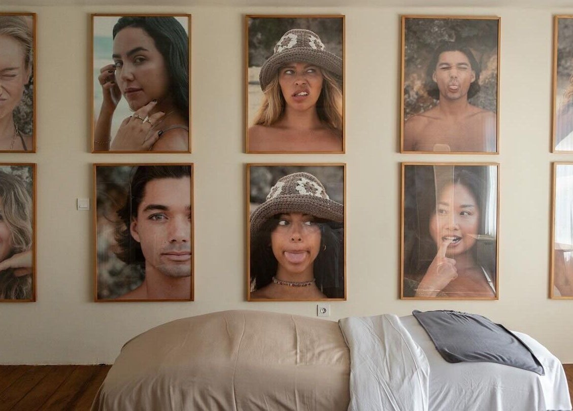 Portraits of diverse individuals on display at Salty Face Bali, Uluwatu, Bali, ID beauty venue.