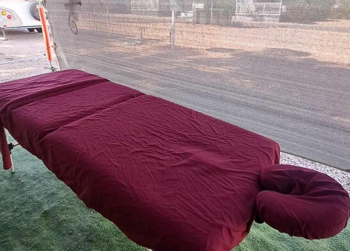 Relaxing massage table at Mobile Massage by Gemma in Port Augusta, South Australia, AU with burgundy sheets.