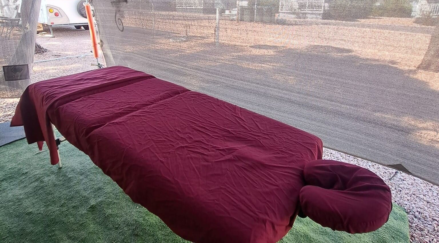 Relaxing massage table at Mobile Massage by Gemma in Port Augusta, South Australia, AU with burgundy sheets.