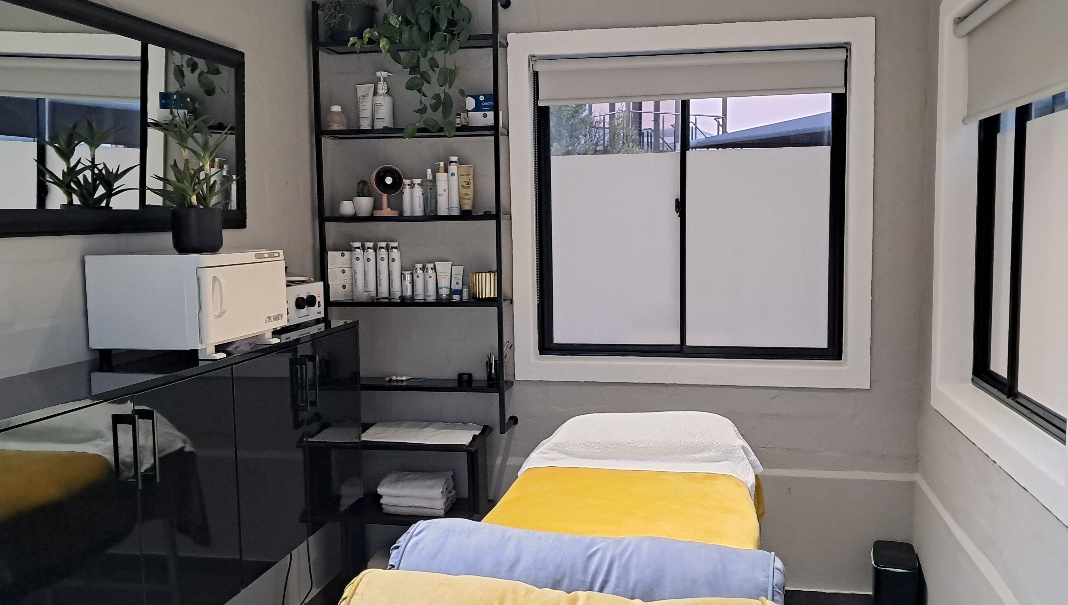 Chontell at Dames en Here spa room with cozy bed in Stellenbosch, Western Cape, ZA.